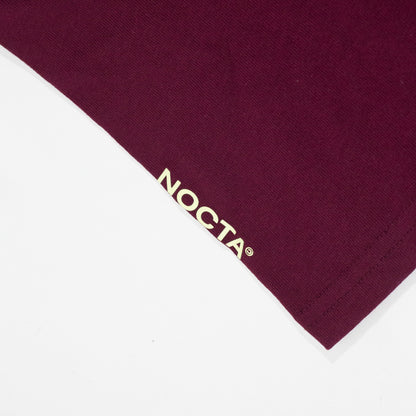 Camiseta Nike x Nocta CS Dark Beetroot