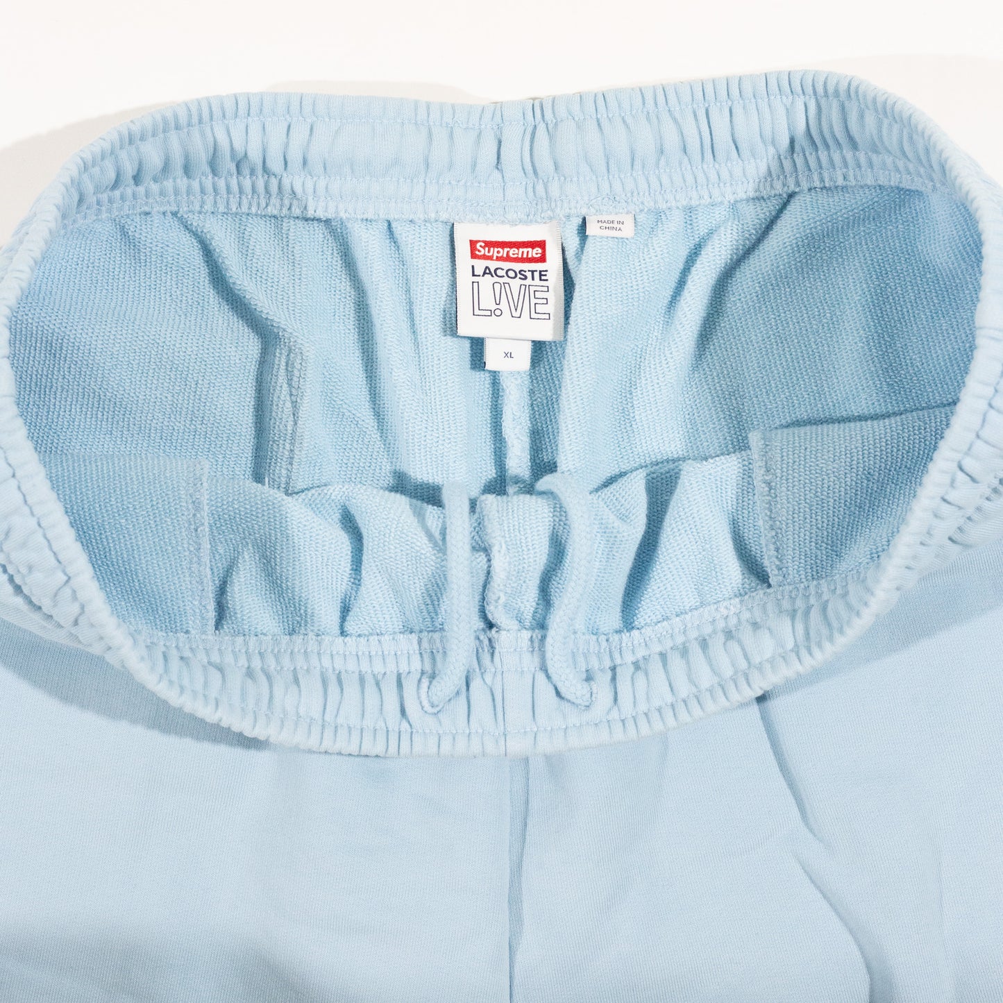 Bermuda Supreme x Lacoste Azul Bebe FW19