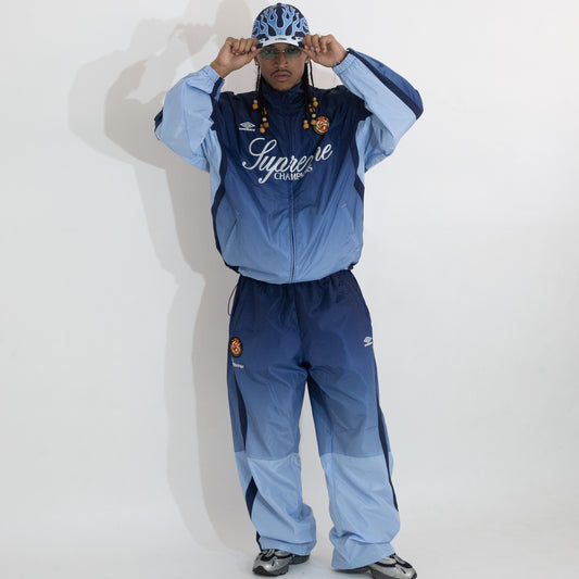 Jaqueta Supreme x Umbro Track Gradient Azul