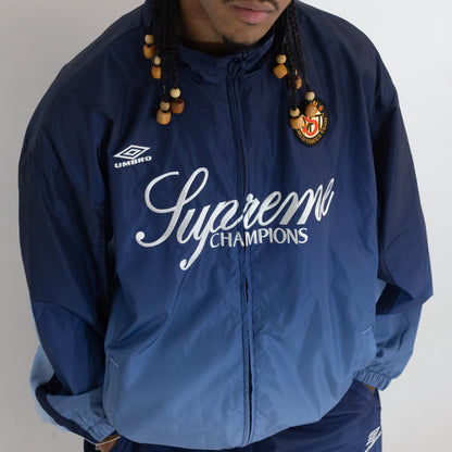 Jaqueta Supreme x Umbro Track Gradient Azul