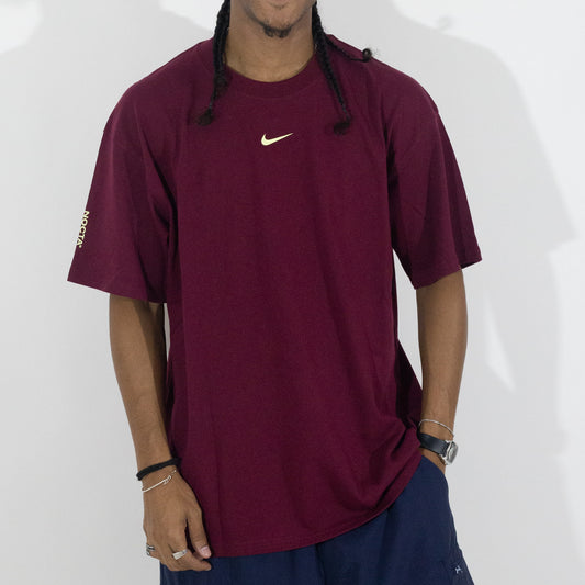 Camiseta Nike x Nocta CS Dark Beetroot
