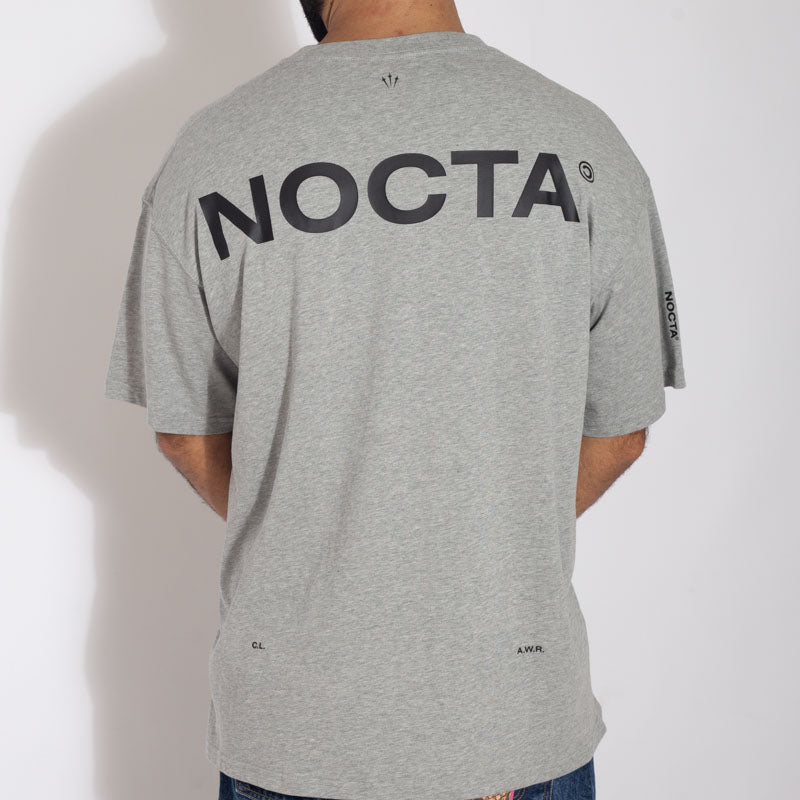 Camiseta Nike x Nocta Cinza